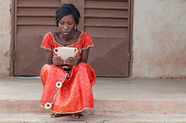 istock Studying Symbol: African Ethnicity Girl Reading Tablet Computer Laptop Mali 531490765