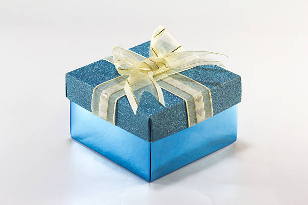 istock Blue gift box with gold ribbon and bow 531491871