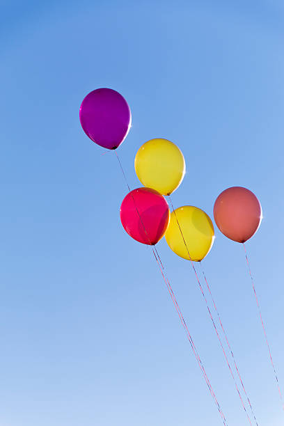 istock Five colorful balloons on clear sky 531503203