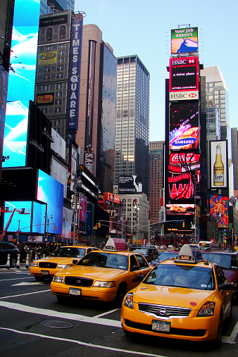 Times Square thee yellow taxi. Big Apple.