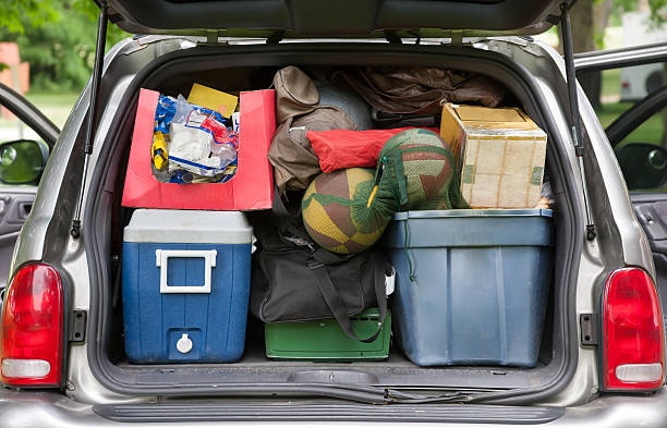 SUV hatchback packed for camping trip a SUV hatchback shot from rear packed full ready to depart from a weekend camping trip camping stove photos stock pictures, royalty-free photos & images