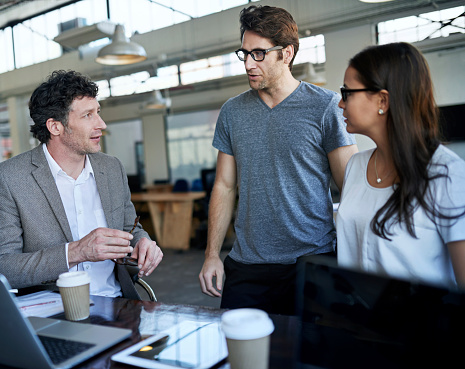Shot of three coworkers talking together in an officehttp://195.154.178.81/DATA/shoots/ic_784693.jpg
