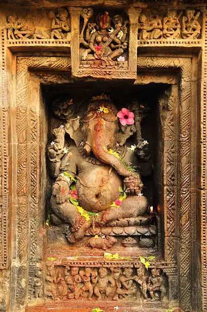 Carved Ganpathi at Sri Someshwara temple at Srimukhalingam, a small town located 60 kilometers from Srikakulam in Andhra Pradesh, India. Elegantly stone carved ancient Hindu shrine was built around 8th century A.D. A typical architectural work in Indo-Aryan or Odisha style.