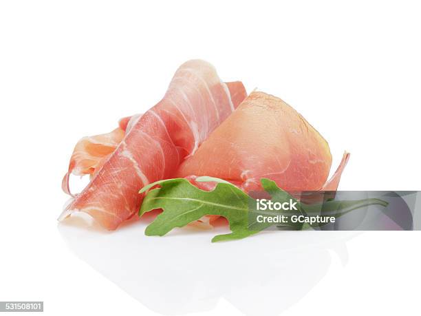 Slice Of Italian Prosciutto With Arugula Leaf Stock Photo - Download Image Now - Parma Ham, Prosciutto, Cut Out