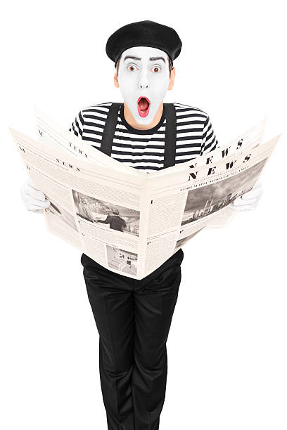 istock Street artist with newspaper making a grimace 531508217