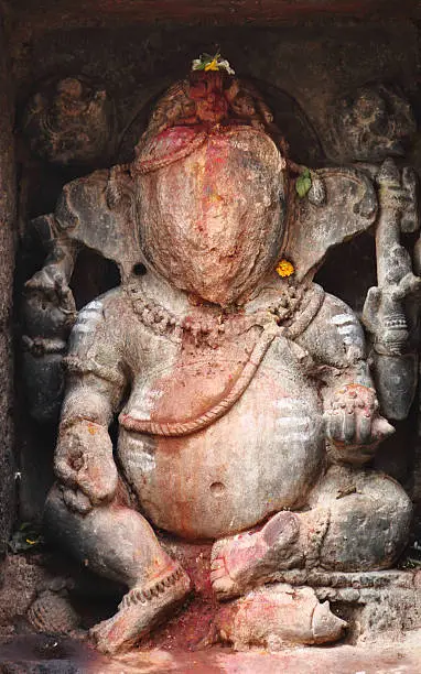 Damaged Idol of Lord Ganesha at Srimukhalingam temple complex, located 60 kilometers from Srikakulam in Andhra Pradesh, India. Elegantly stone carved ancient Hindu shrine was built around 8CE. A typical architectural work in Indo-Aryan or Odisha style.