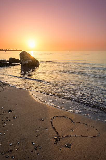 istock Heart drawn on the beach sand 531509199