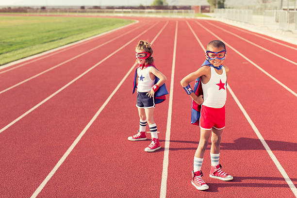 istock Young Children dressed as Superheroes on Running Track 531516675