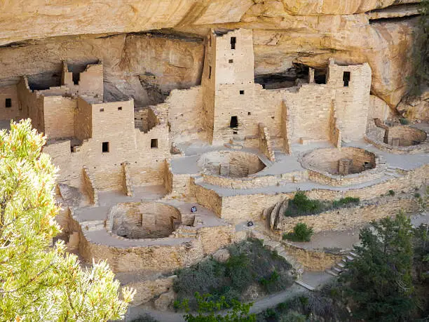 the dwellings in Mesa Verde National Park in the shadows of the cliff