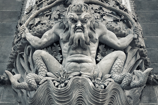 Sintra, Portugal - December 30, 2014: A sculpture of strange angry looking creature above a doorway on an exterior wall of the Pena National Palace in Sintra.
