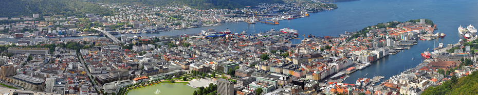 Bergen, Norway - July 18, 2014: Panoramic view to the city of Bergen, Norway, from Floyen mountain, with vessels in the harbor, in July 2014.
