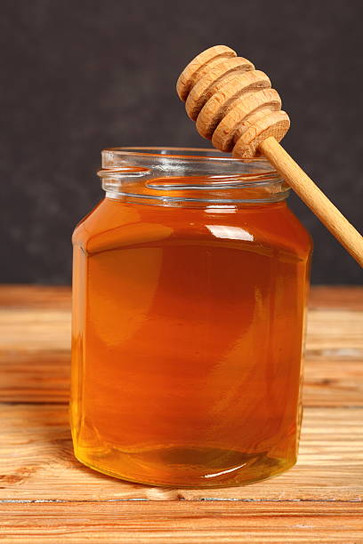 istock Jar of Honey with Honey Dipper 531520009