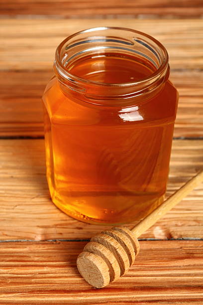 istock Jar of Honey with Honey Dipper 531520011