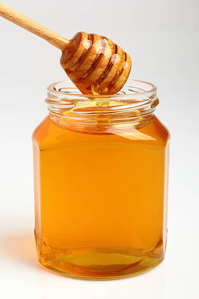 istock Jar of Honey with Honey Dipper 531520037
