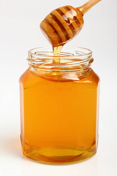istock Jar of Honey with Honey Dipper 531520039