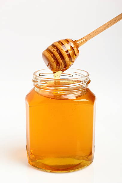istock Jar of Honey with Honey Dipper 531520041