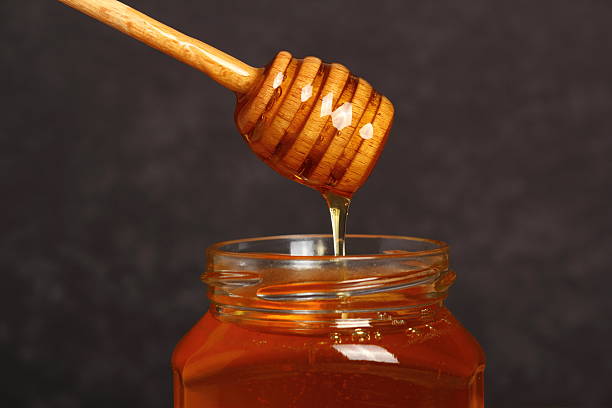 istock Jar of Honey with Honey Dipper 531520047