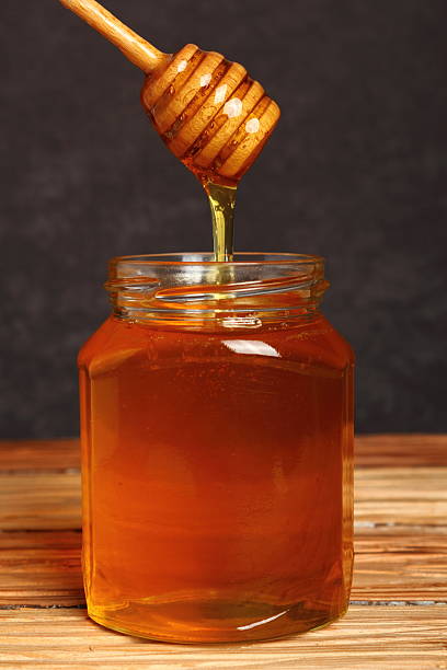 istock Jar of Honey with Honey Dipper 531520049