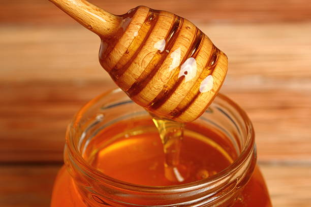 istock Jar of Honey with Honey Dipper 531520057