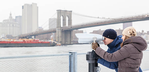 istock Young  man, tourist, looking to Manhattan with binocular 531523089