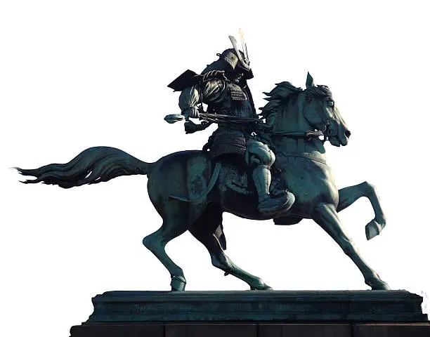 This bronze Kusunoki Masashige Statue is in the city park,  outside of the Imperial Palace in Tokyo Japan. The statue was commissioned by the Japanese government around 1880 and took workers 2 years to build. Kusunoki was an ancient Japanese hero that became the patron saint of Kamikaze pilots during WWII. 