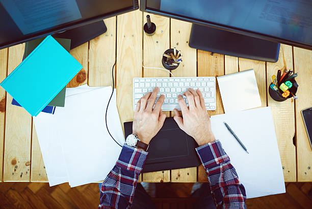 istock Young man in home office typing 531531273