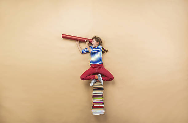 istock Girl with books 531532343