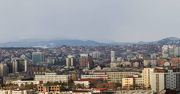 Prishtina by Day Prishtina, Kosovo: Skyline of the Kosovar capital on a cloudy winter day. kosovo stock pictures, royalty-free photos & images