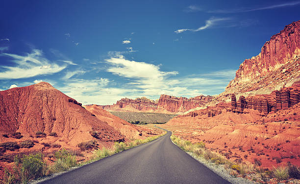 istock Vintage toned curved road, travel concept. 531535608