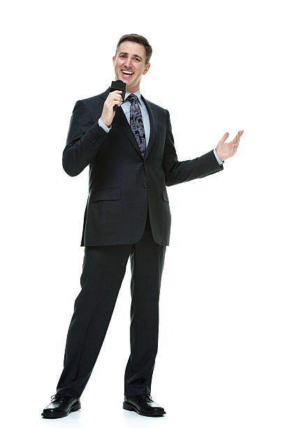 istock Smiling businessman speaking into a microphone 531535907
