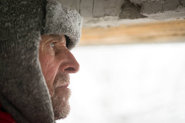 istock Man Looking  through Great War's Bunker Porthole , Snowing, Alps, Europe 531535909