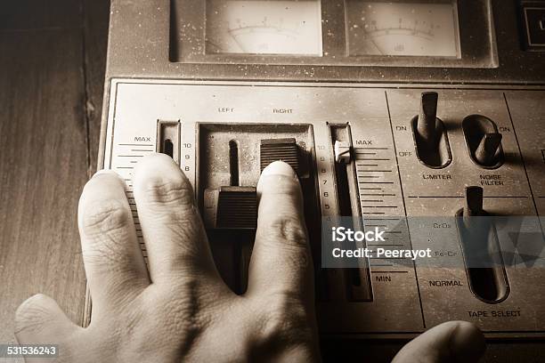 Human Hand Controlling Radio Sound Sepia Filtered Stock Photo - Download Image Now - 2015, Audio Equipment, Balance