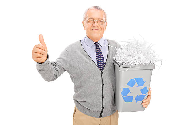 istock Senior holding a recycle bin and giving thumb up 531536839