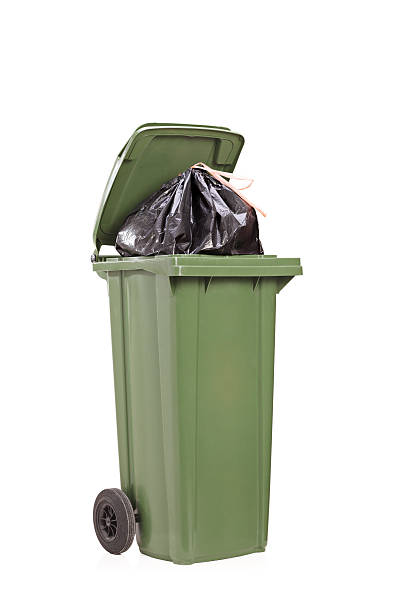 istock Studio shot of a big green trash can 531536857