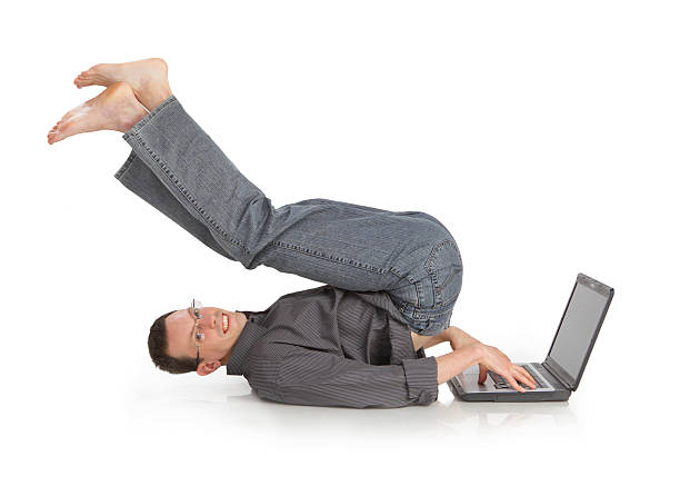 istock flexible cheerful guy with the laptop 531539140