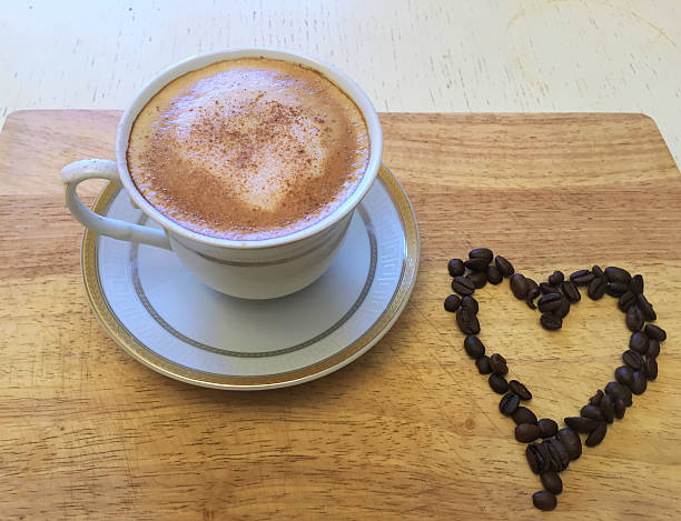 istock Coffee & heart. Coffee & beans on wooden table 531539820