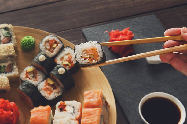 istock Set of sushi maki and rolls at black rustic wood 531540434