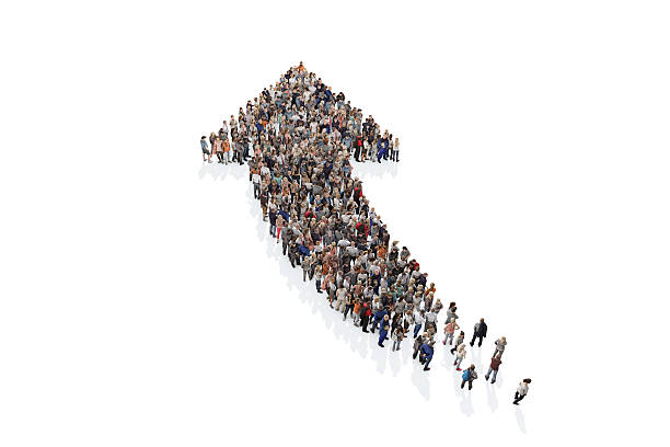 istock Group of people forming a directional arrow sign 531540844