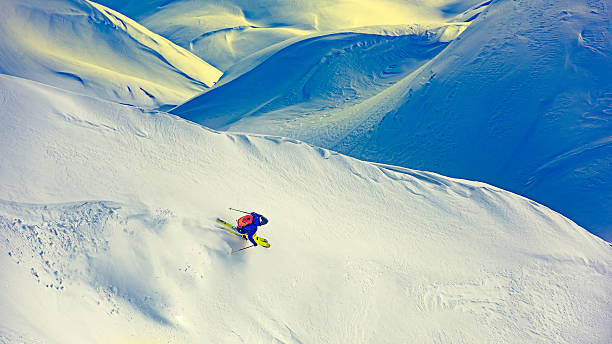 Skier skiing off-piste on a beatiful mountain slope