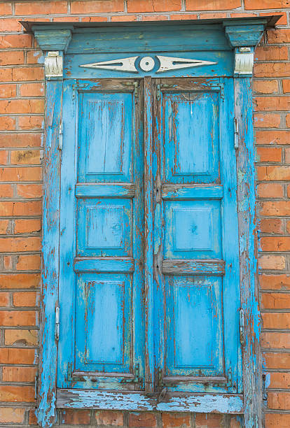 istock Old window with closed wooden shutters 531543186
