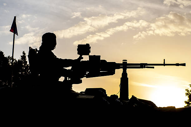 istock soldier on a tank with an automatic rifle 531543814