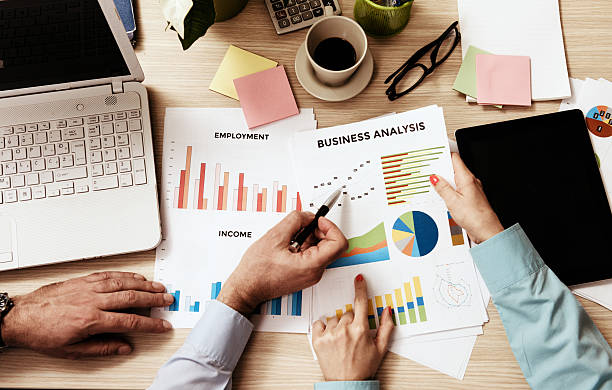 istock Teamwork with two business people in office with business analysis 531545994
