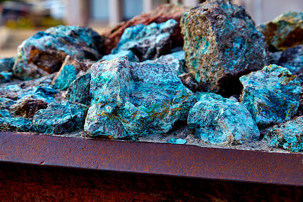 Raw Copper Ore Chunks of copper ore mineral rocks in an iron barrel mineral stock pictures, royalty-free photos & images