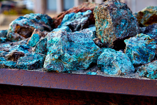 Raw Copper Ore Chunks of copper ore mineral rocks in an iron barrel oxides stock pictures, royalty-free photos & images