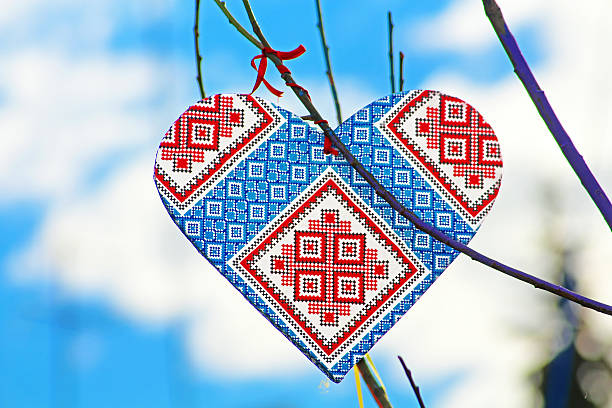 Hand made heart in the style of Ukrainian vyshyvanka Hand made heart in the style of Ukrainian vyshyvanka on the handmade tree which children made due to Europe Day in Vinnytsia, Ukraine. Vyshyvanka is the colloquial name for the embroidered shirt in Ukrainian national costume. Vyshyvanka is distinguished by local embroidery features specific to Ukrainian embroidery vinnytsia photos stock pictures, royalty-free photos & images