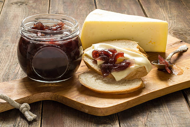 Onion jam, white bread and cheese stock photo