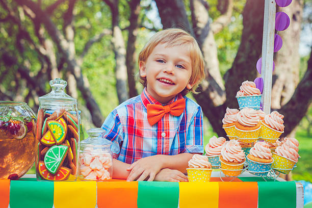 istock Child behind lemonade stand 531547900