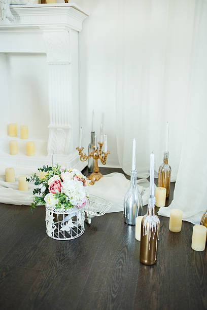 istock Flowers and candles at the fireplace 531548260