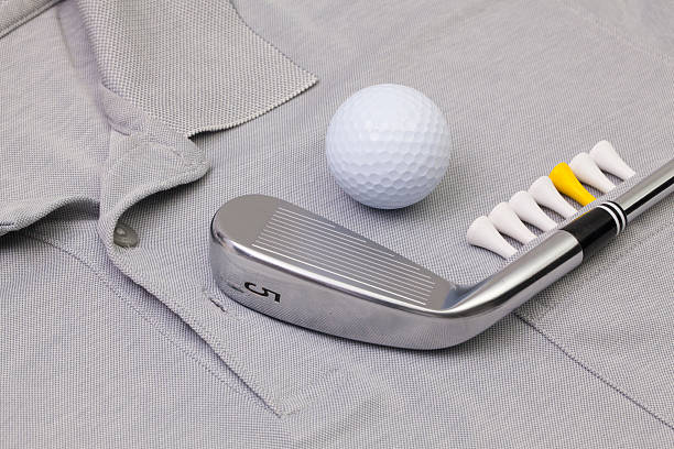 istock Grey polo shirt and golf equipments 531552638