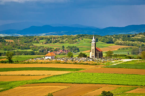 istock Church and graveyard on picturesque landscape 531552906